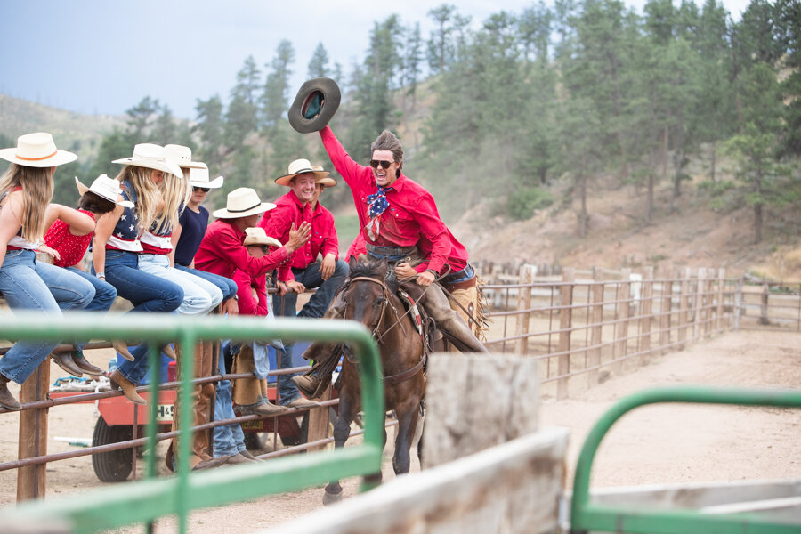 guests watching a wrangler rodeo