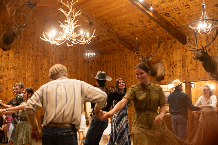 guests line dancing at our sedalia co ranch