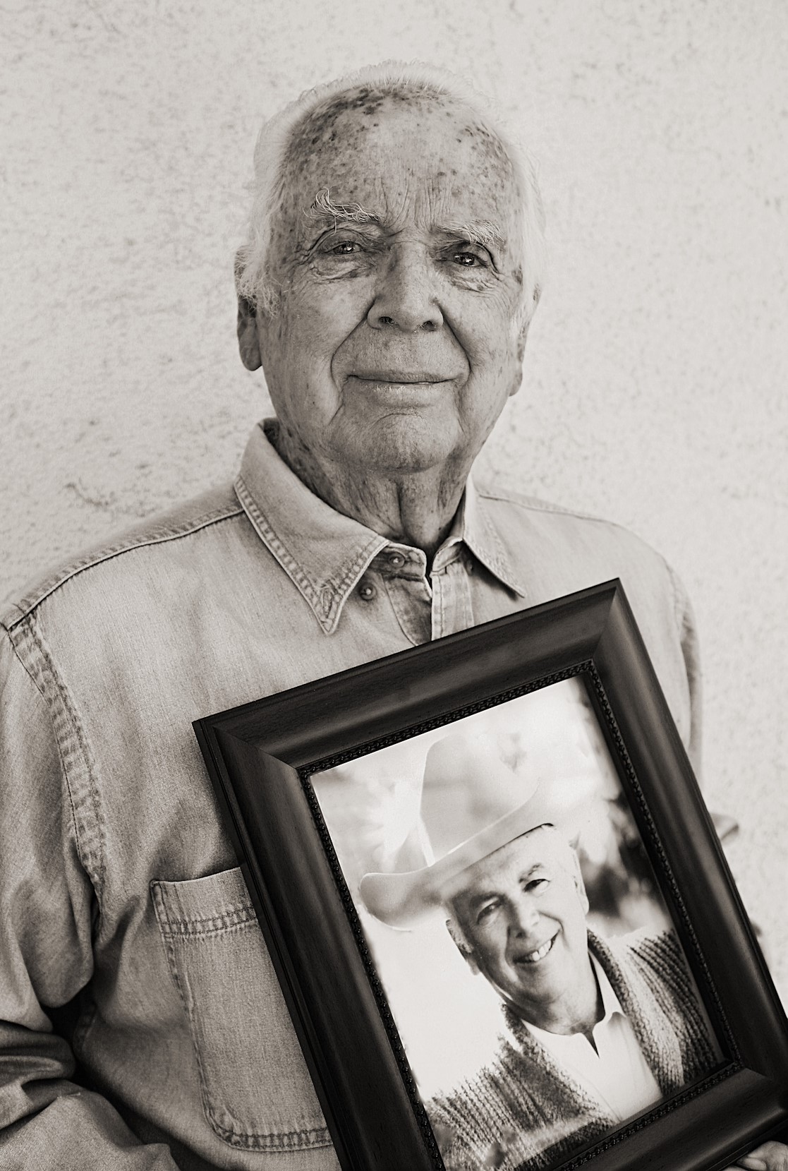 Colorado Dude ranch owner holding image of a man | Lost Valley Ranch